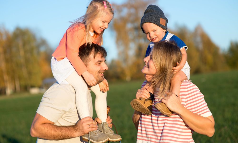 happy-family-dad-and-mom-with-two-children-having-2023-11-27-05-30-27-utc